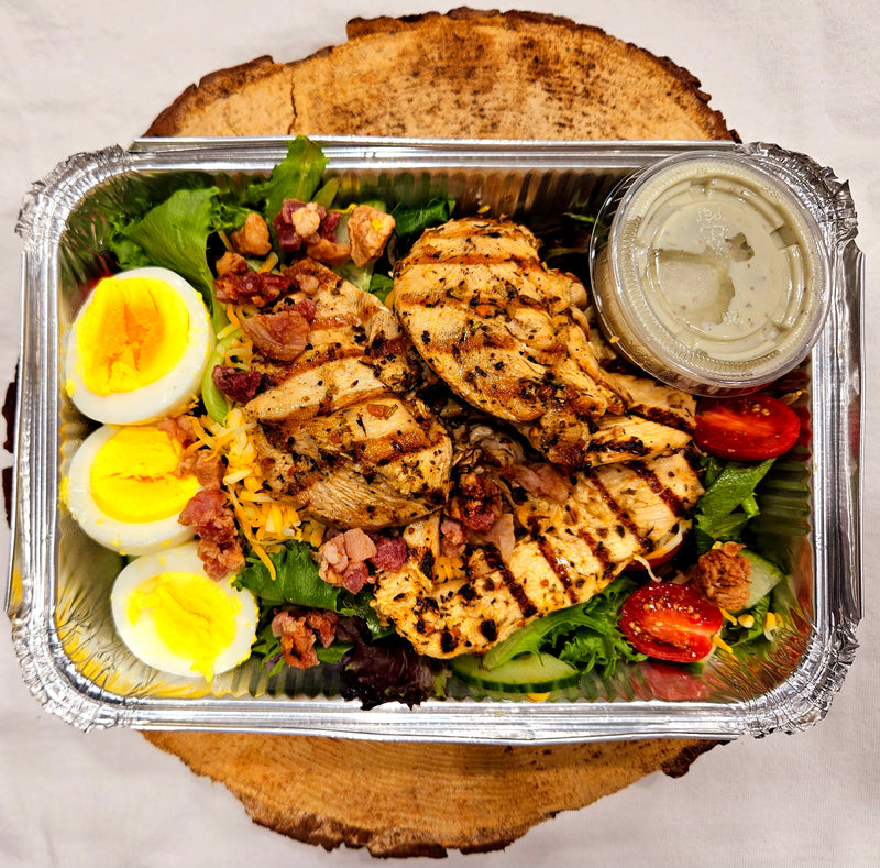 Cobb salad with mixed lettuce, bacon, grilled chicken, blue cheese vinaigrette
