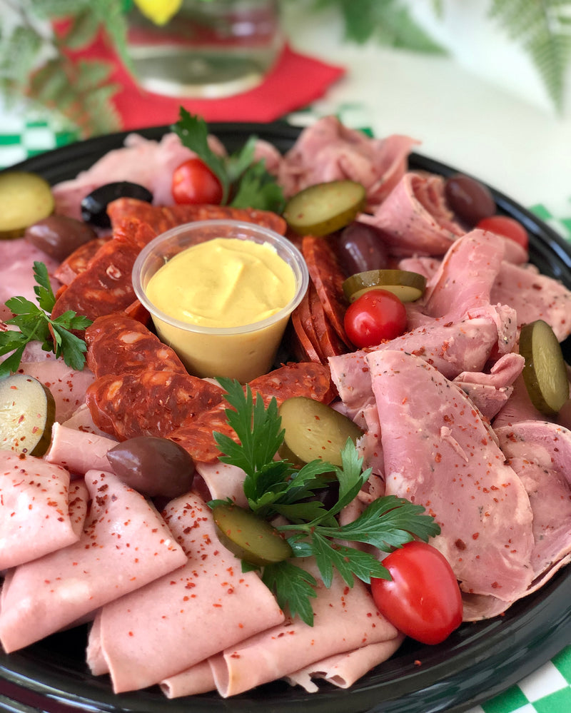 Platter of charcuterie, sausages, olives, pickles, dijon and foccacia