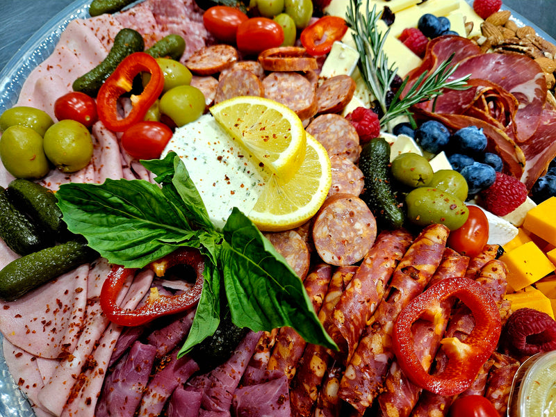 Combined platter of cheese, cold meats, sausages, olives, pickles, nuts and Italian foccacia